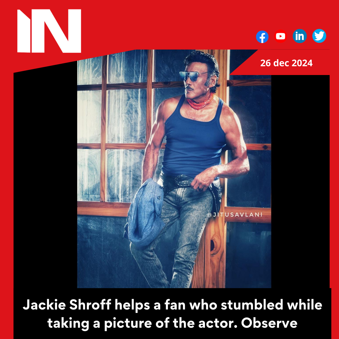 Jackie Shroff helps a fan who stumbled while taking a picture of the actor. Observe